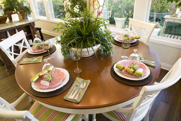 Dining room and table with festive decor.