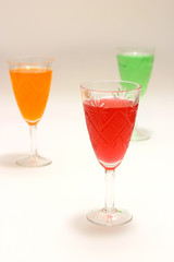 three filled wineglasses