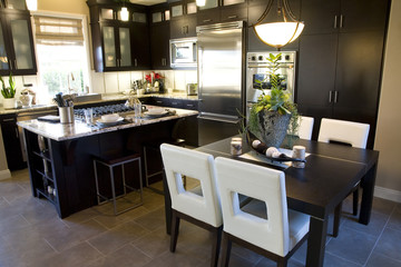 Kitchen with breakfast table and modern decor. 