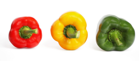 Multicolored peppers on the white background