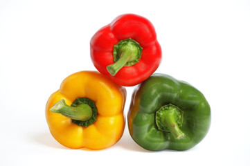 Multicolored peppers on the white background