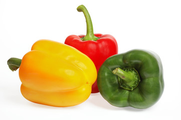 Multicolored peppers on the white background