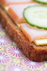 fragment of sandwich from pumpernickel bread