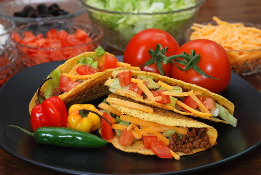 Prepared tacos with tomatoes, habanero and serano peppers 