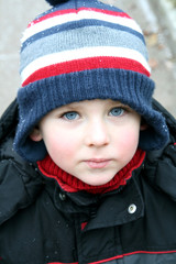 Winter child with beautiful blue eyes