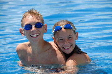 Happy swimmers in pool
