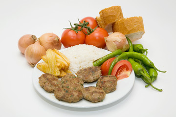 meat balls with french fries and rice on white