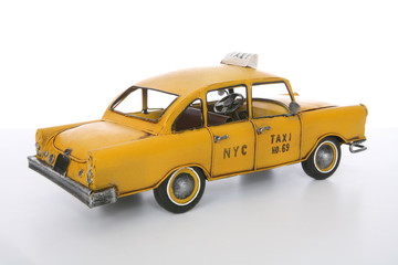 An old vintage taxi cab over a white background
