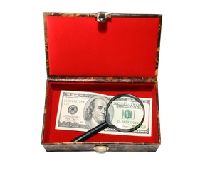Red casket with 100 dollar banknote