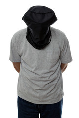 Man with a black hood over his head and his hands tied 