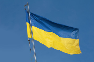 National flag of Ukraine on blue sky