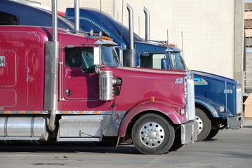 Fototapeta na wymiar two trucks at warehouse