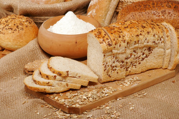 Assortment of baked breads on burlap fabric
