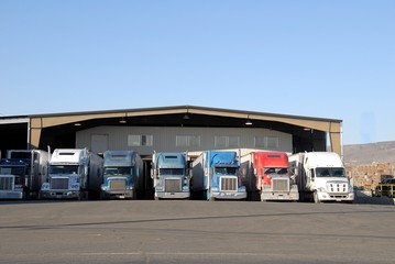 seven trucks at warehouse