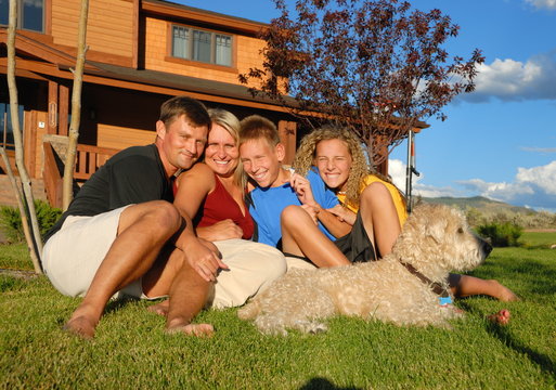 Happy Family Outside House