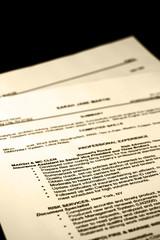 Obraz premium A fictitious resume tinted with a black background