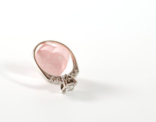 engagement ring on a candy heart, saying 