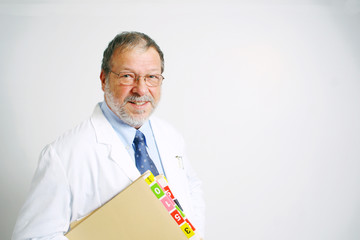 Senior doctor with files smiling