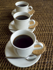 Three cups of coffee in a row
