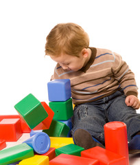 small boy with toys on white background