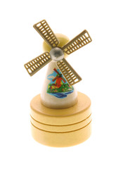 Miniature wooden windmill souvenir on white background
