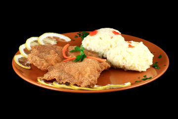 close up of a pork schnitzel in a plate