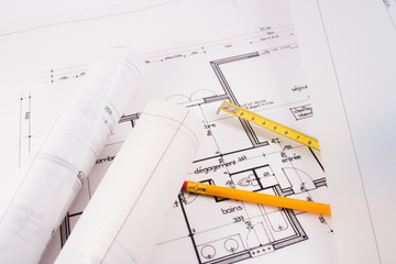 Plans of a house designed by an architect with a yellow pencil