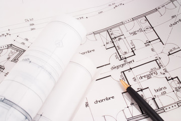 Plans of a house designed by an architect with a black pen