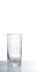 Empty glass on the table. Isolated on white.
