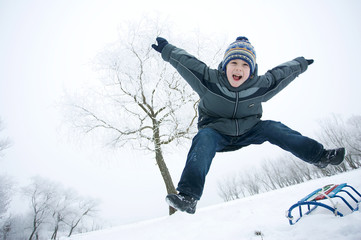 Fototapeta na wymiar boy jump winter