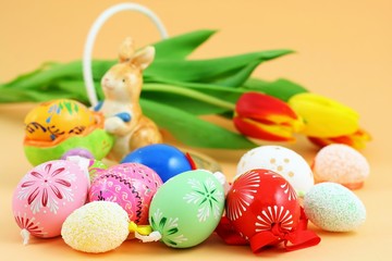 Easter eggs and hare with tulips in background
