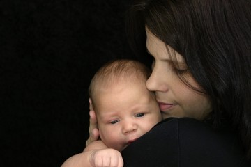 Gentle photo of newborn and mother