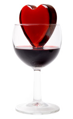 Glassy heart in a glass of wine   