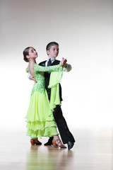 Boy and girl dancing ballroom dance