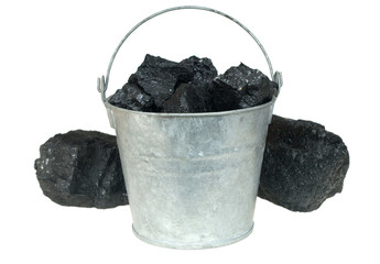 Pieces of coal  in bucket isolated on white background
