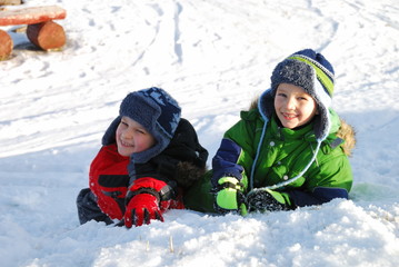 Fototapeta na wymiar Boys playing in snow