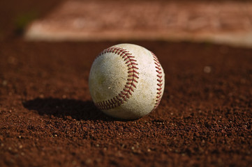 Baseball on the green grass of a ball field