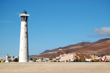 Fototapeta na wymiar Lighthousein Jandía beach. Sapin