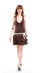 Young girl in summer clothes isolated at the white background