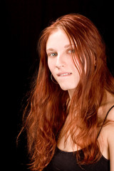Naklejka premium beautiful redhead biting bottom lip