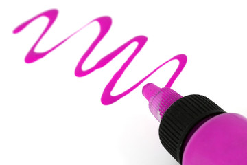A pink paint bottle with paint strokes