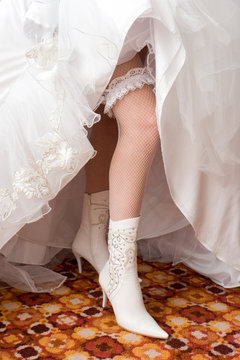 a sexy leg of the bride in a boot