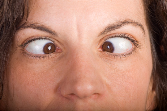 Closeup Of Brunette Woman Face Seriously Squinting