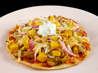 Healthy gourmet tandoori chicken and roast pumpkin pizza.
