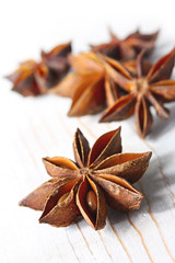 Star anise on weathered white timber.  
