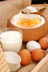 Eggs and a bowl of flour.