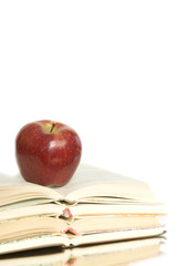 Red apple and stack of books 