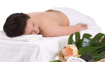 Obraz na płótnie Canvas Beautiful brunette lying on a massage table 