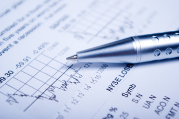 Business accessories on a background of diagrams. closeup