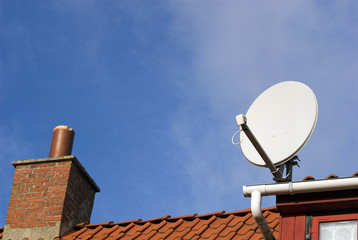 Parabolic Antenna on red roof